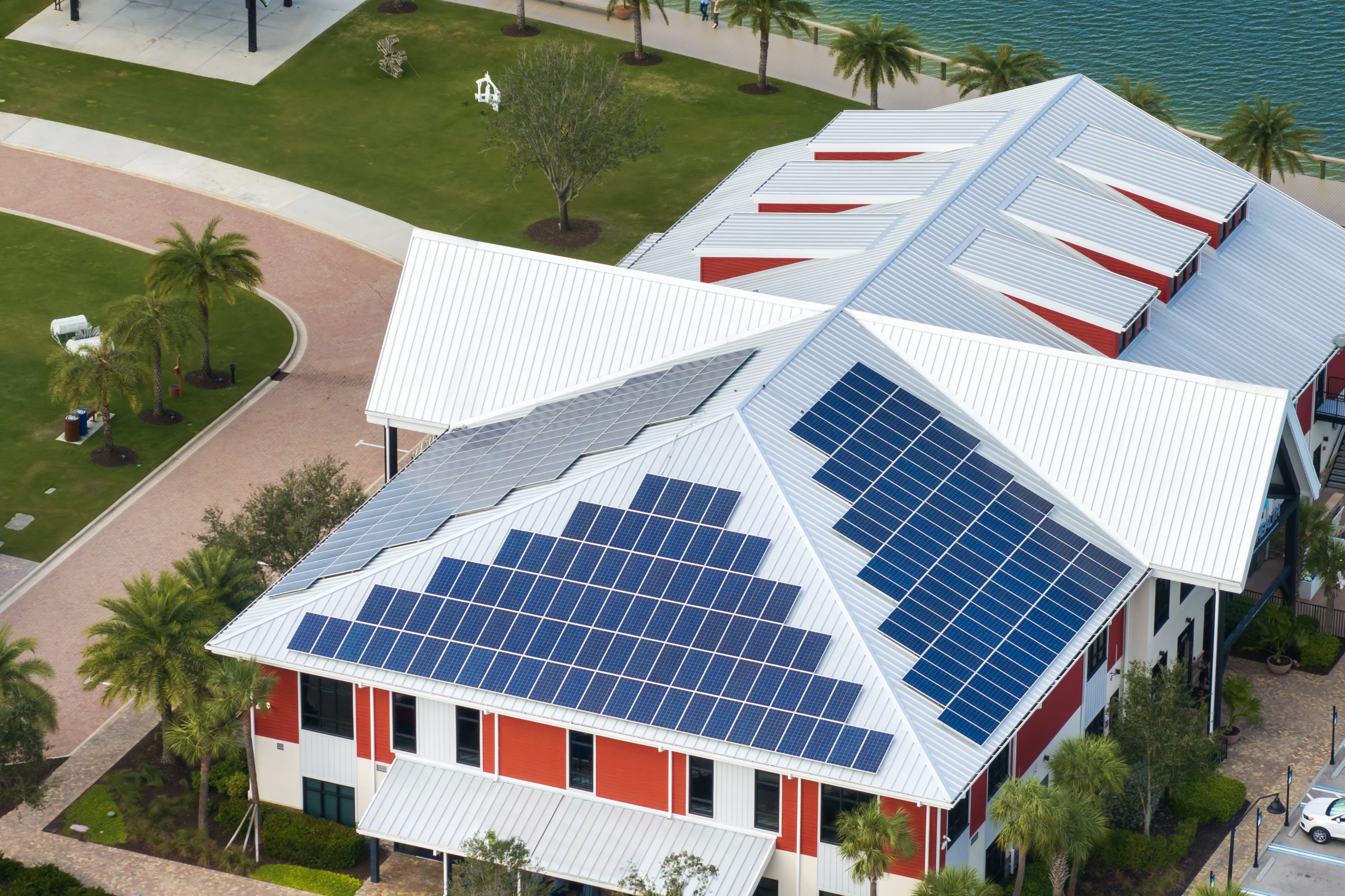 Florida office building with solar roof. Blue photovoltaic panels